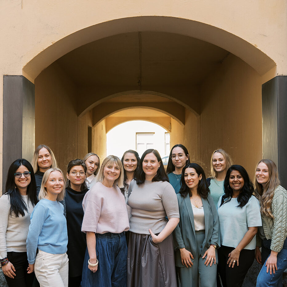 Compass Psychology A group photo of the whole Compass Psychology team under an archway